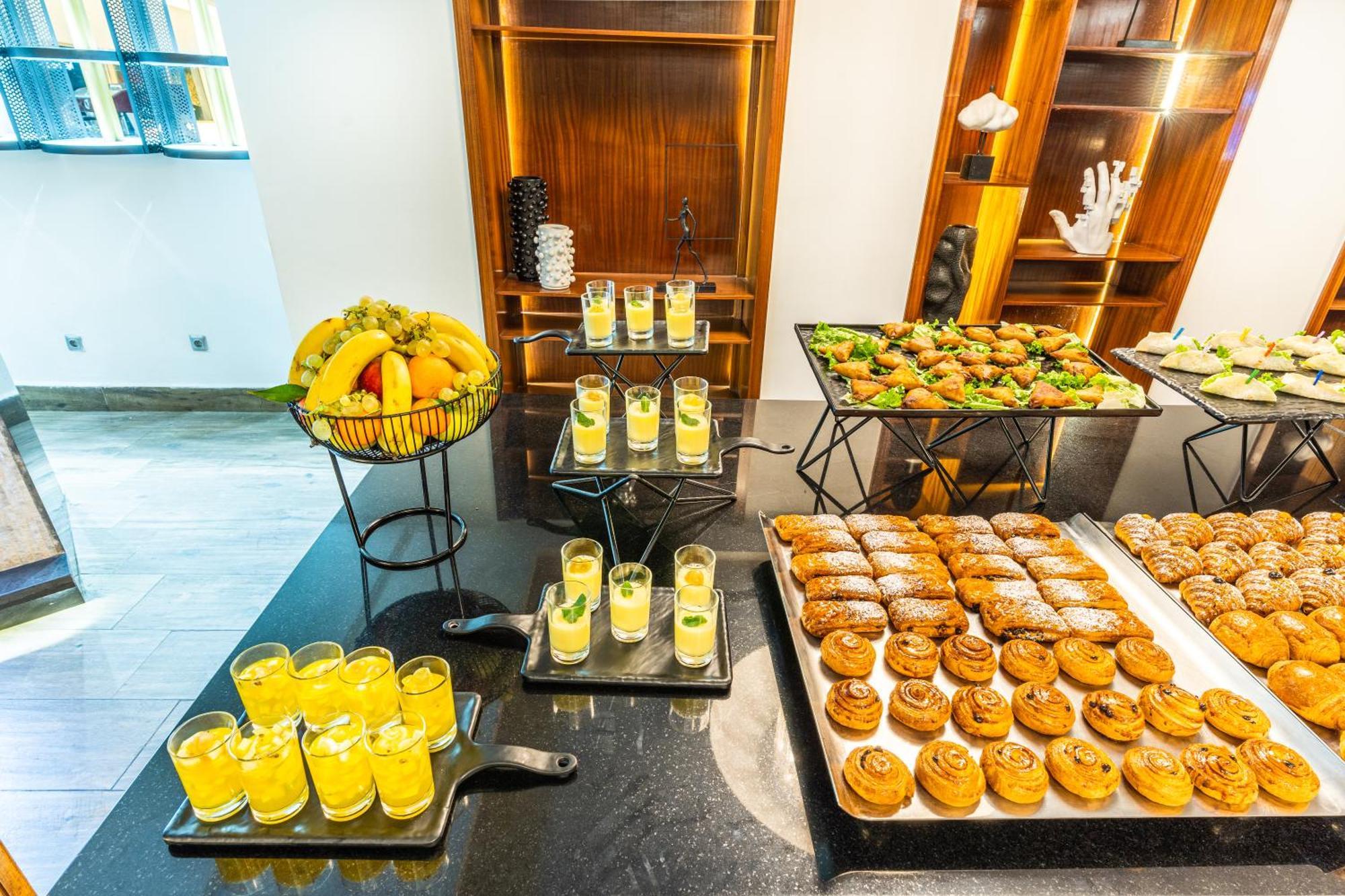 One Hotel Казабланка Екстериор снимка A selection of desserts at a buffet